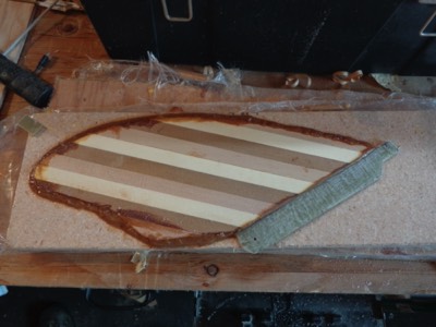  The wood is glued to the fiberglass base. 