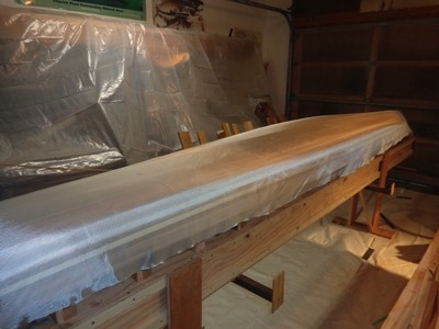  3/7/16 - Fiberglass cloth is laid on the hull. 