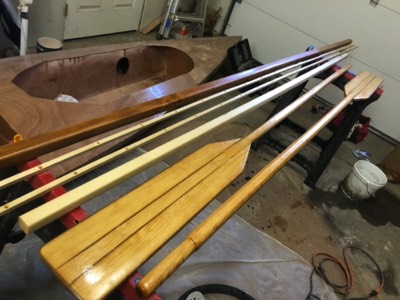  The oars, spars, and rubrails are varnished. 