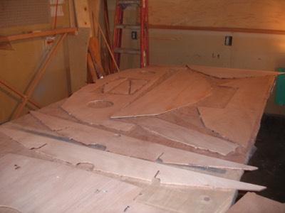  1/30/11 - The reverse sides of the bulkheads are sanded. 