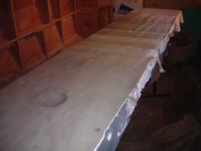  Fiberglass cloth is laid on the tank lid.   