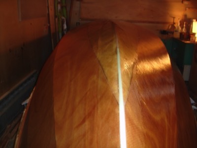  5/8/11 - Starboard side gets a fill coat and the port side is fiberglassed.  